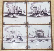 A set of four 18th century Dutch Delft manganese tiles decorated with buildings by a canal (frame