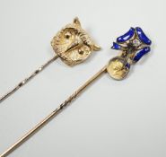 An early 20th century yellow metal enamel and diamond set ribbon bow stick pin, hung with a