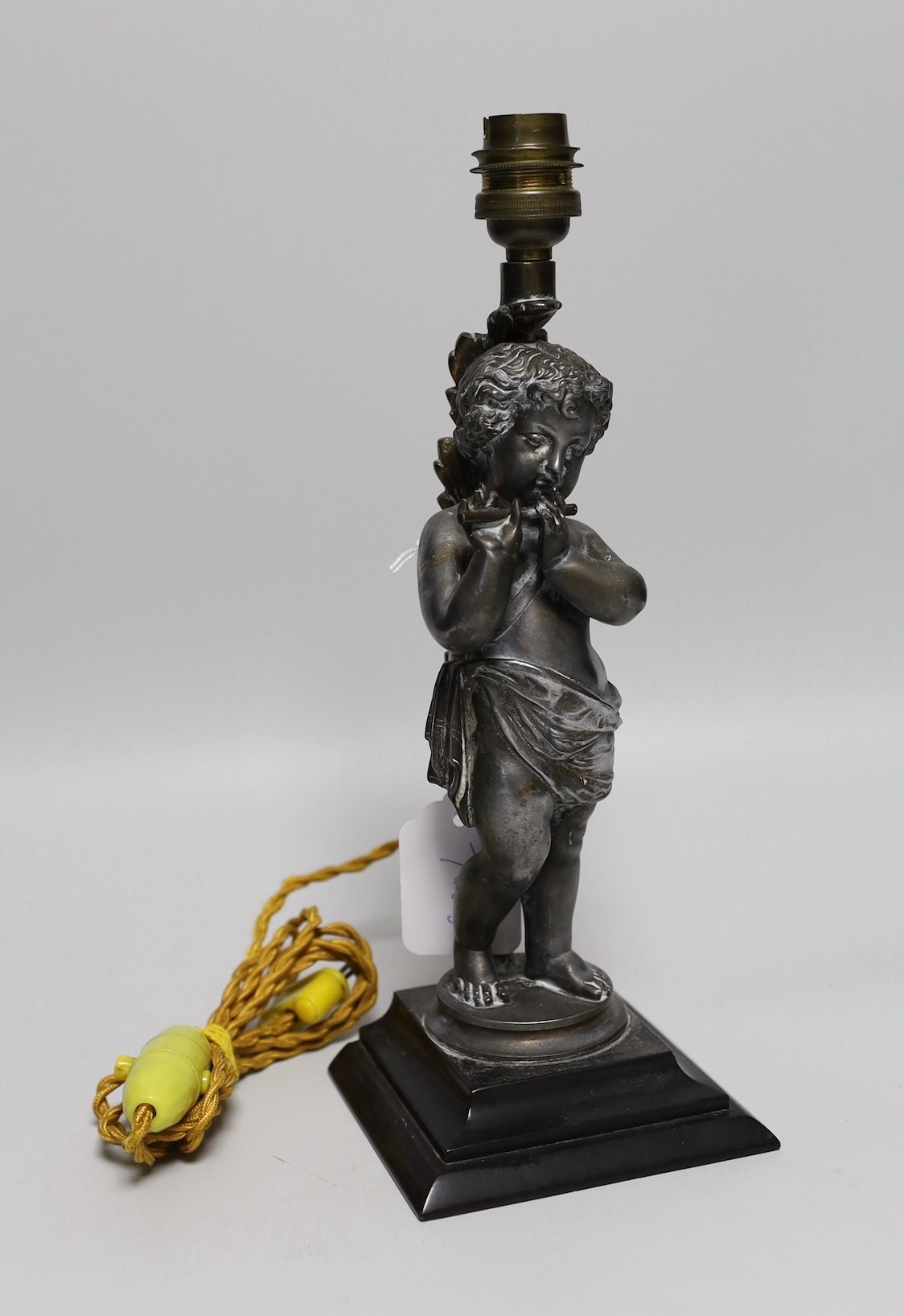 A metal musical putti lamp base, 30cms high