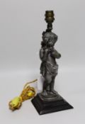 A metal musical putti lamp base, 30cms high