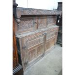 A 17th century carved oak court cupboard, dated 1685, width 170cm, depth 55cm, height 150cm