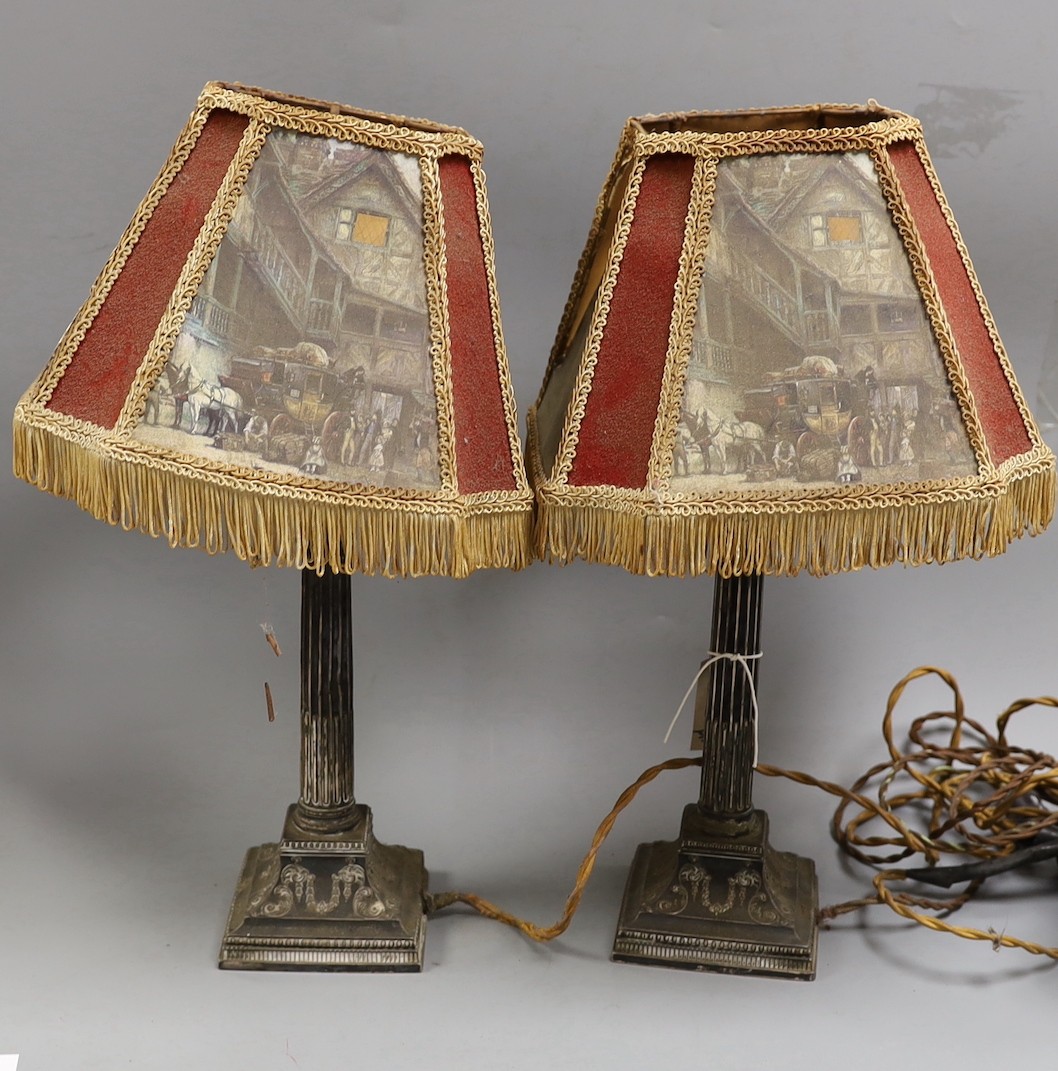 A pair of late Victorian silver Corinthian column candlesticks, now drilled and converted to table