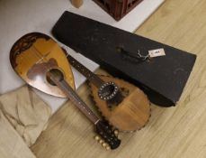 A Japanese mandolin and two Italian mandolins (one cased), approximately 61cms long