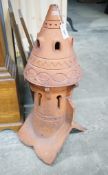 A terracotta dovecote hip tile, height 89cm