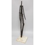 A 20th century abstract figural bronze, 63cms high