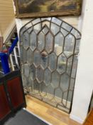 A cast iron mirrored glass window frame, width 122cm, height 171cm