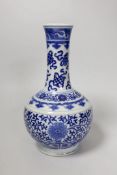 A late 19th century Chinese blue and white ‘eight Buddhist emblems’ vase, apocryphal Kangxi mark,