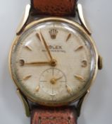 A gentleman's mid 1950's 9ct gold Rolex shock-resisting manual wind wrist watch, with baton and