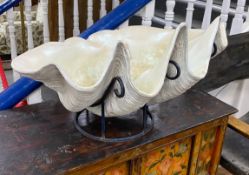 A large simulated clam shell, on stand, width 82cm, height 42cm