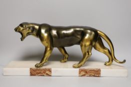 An Art Deco model of a spelter panther on a marble base, 50cms wide in total