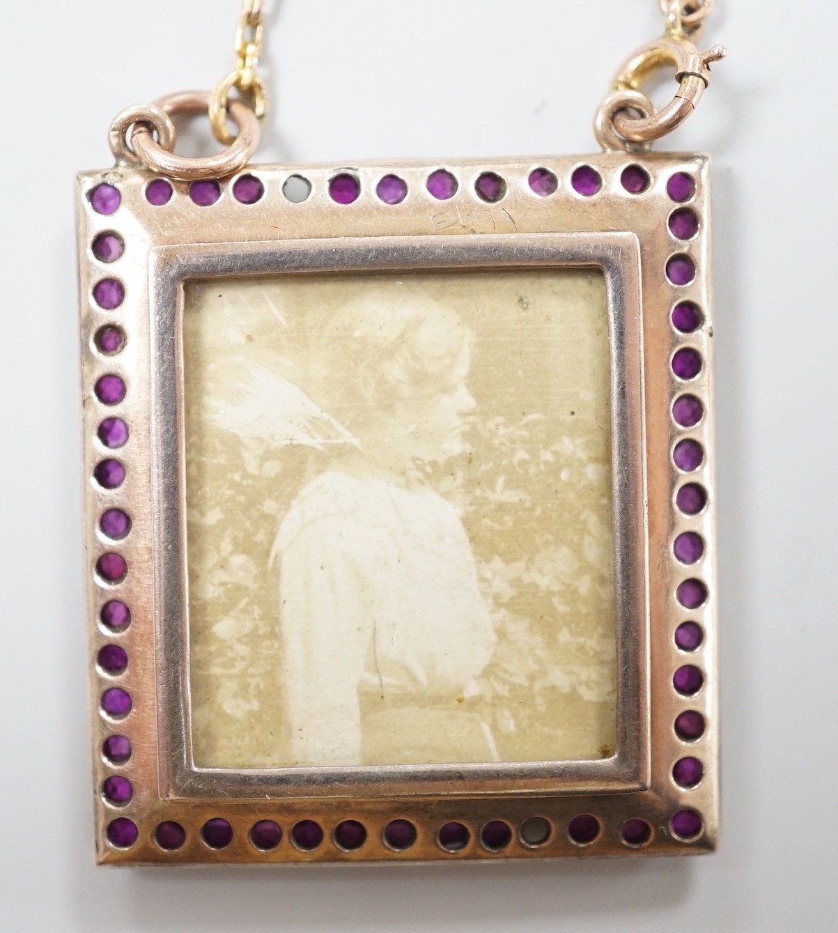 An early 20th century yellow metal, ruby and diamond mounted portrait pendant, 34mm (two rubies - Image 4 of 4