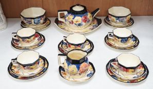 A Doulton “pansy” design tea set, marked on base D4049, Reg no:597783