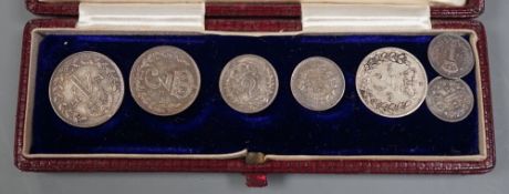 An 1897 cased maundy set and two other coins