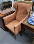 A Regency upholstered simulated coromandel wing armchair on faux bamboo legs, width 67cm, depth