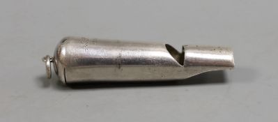 An early 20th century Chinese Export white metal whistle by Wang Hing, Hong Kong, 71mm.