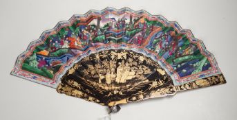 A 19th century Chinese painted paper leaf and lacquer painted fan in a gilt decorated black