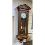 A 19th century German Vienna regulator wall clock, Lenzkirch movement with pendulum and weights, oak