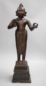 A large and heavy 19th century Indian bronze figure of Radha with separate bronze pedestal, total