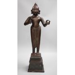 A large and heavy 19th century Indian bronze figure of Radha with separate bronze pedestal, total