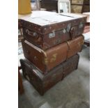 Three vintage suitcases, largest width 75cm