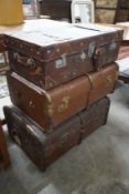 Three vintage suitcases, largest width 75cm
