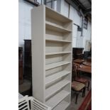 A painted open bookcase, width 109cm, depth 33cm, height 232cm