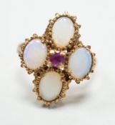 A 1970's 9ct gold, four stone white opal and single stone ruby cluster set dress ring, size O, gross