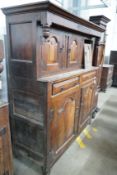 A mid 18th century oak court cupboard, initialled MR and dated 1744, width 155cm, depth 57cm, height