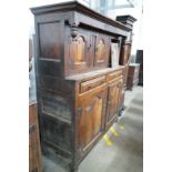 A mid 18th century oak court cupboard, initialled MR and dated 1744, width 155cm, depth 57cm, height