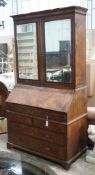 A mid 18th century feather banded figured walnut bureau cabinet, width 111cm, depth 57cm, height
