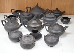 A collection of Wedgwood and other black basalt teapots and tea wares, 19th/early 20th century,