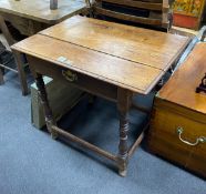An early 18th century pine topped side table, fitted with a drawer, width 84cm, depth 59cm, height