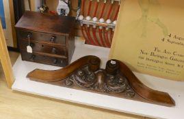 A Victorian mahogany miniature three drawer chest and a carved mahogany furniture pediment, 97cms