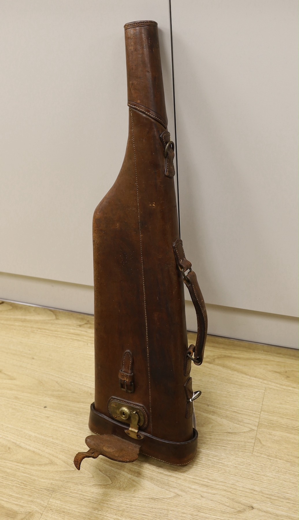 A brown leather gun case, 79cm wide