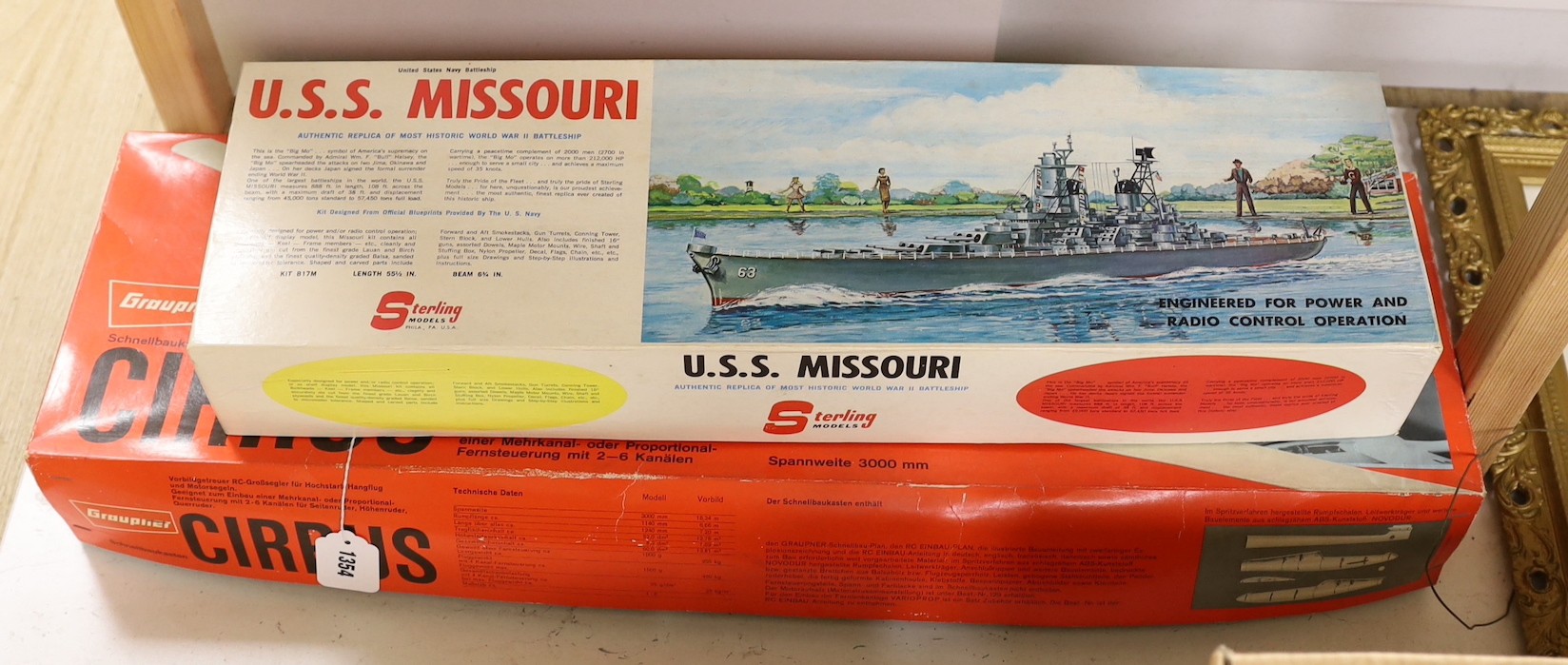 Two boxed kit models, USS Missouri and Cirrus