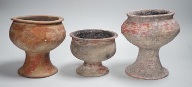 Three Ban Chiang pottery pedestal vessels, Thailand, 300 BCE–200 CE, tallest 16cm