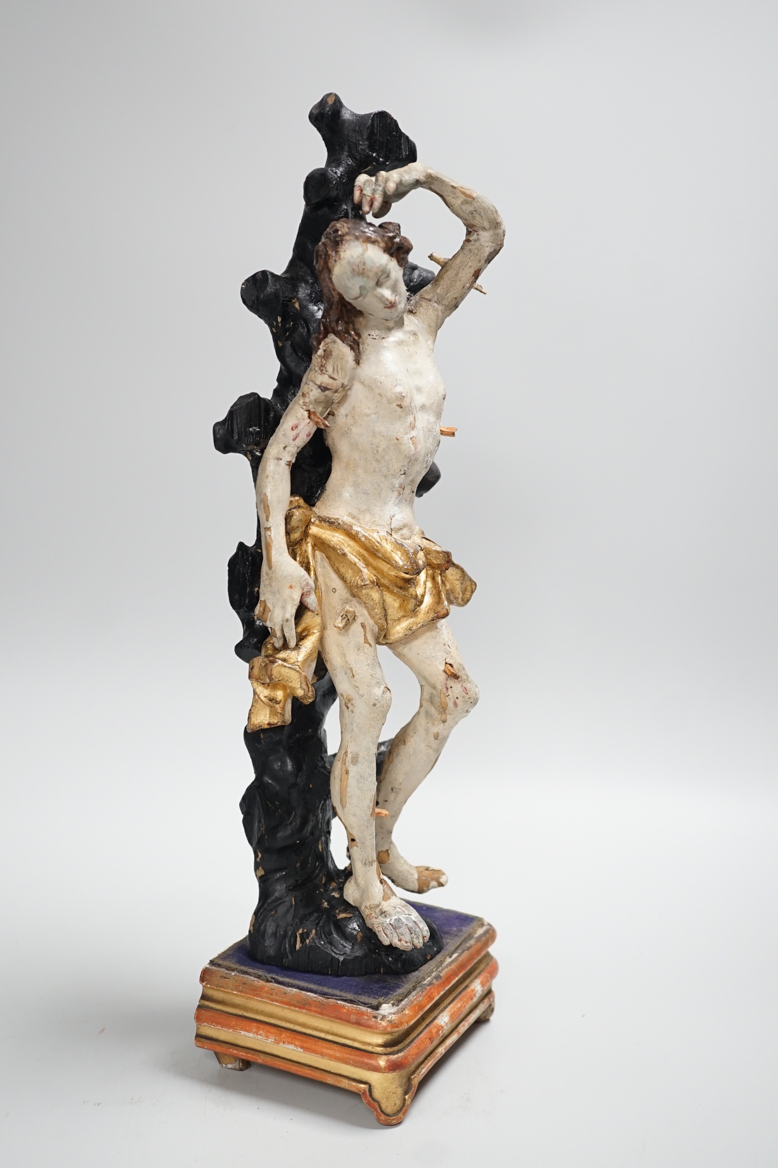 A 19th century Continental carved wooden polychrome figure of St. Sebastian on stand, total height - Image 3 of 6