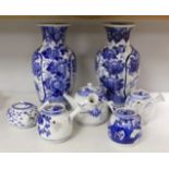 A pair of Japanese blue and white vases and various Japanese blue and white porcelain teapots and