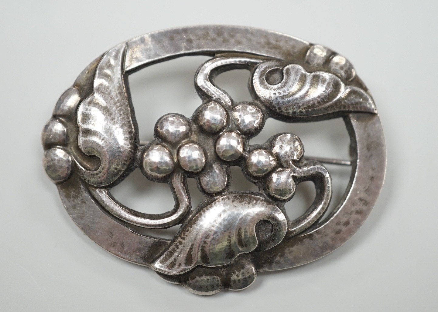 A Georg Jensen modern sterling silver oval leaf and berry brooch, design no. 101, 48mm, with