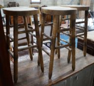 Three turned beech bar stools, height 77cm