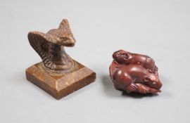 A Chinese bronze 'cobra' seal and a Japanese carved wood netsuke with signed mother of pearl