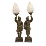 A pair of bronzed spelter figural table lamps, with flame shades, approximately 72cms high