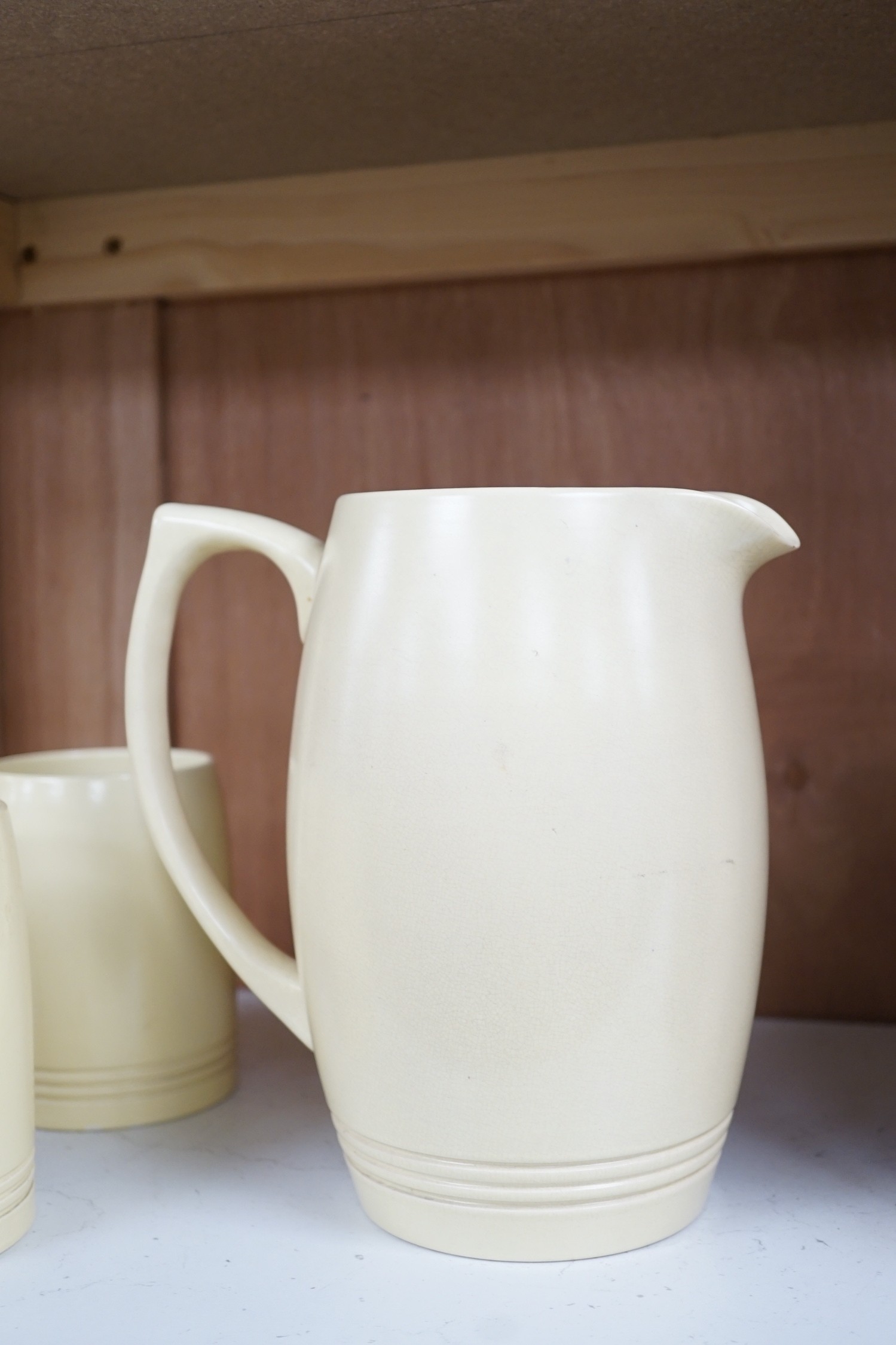 Keith Murray for Wedgwood- a cream-glazed jug and six similar mugs, jug 20.5cms high - Image 3 of 5