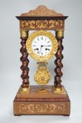 A 19th century Napoleon III rosewood inlaid and ormolu mounted portico clock, 47cms high