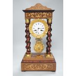 A 19th century Napoleon III rosewood inlaid and ormolu mounted portico clock, 47cms high