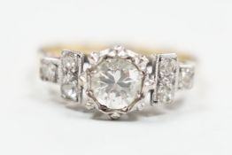 An 18ct and single stone diamond ring, with diamond set shoulders, size H, gross weight 2.6 grams,