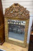 A 17th century style Italian design carved giltwood wall mirror, width 100cm, height 170cm