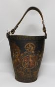 A Victorian leather bound coat of arms fire bucket, bucket 30cms high (not including handle)