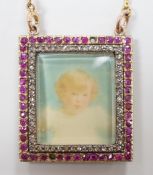An early 20th century yellow metal, ruby and diamond mounted portrait pendant, 34mm (two rubies