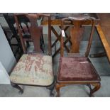 Two 18th century walnut and fruitwood dining chairs with solid splat and cabriole legs